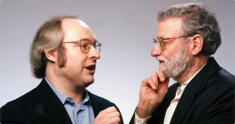Don Norman discussing something with Jakob Nielsen.